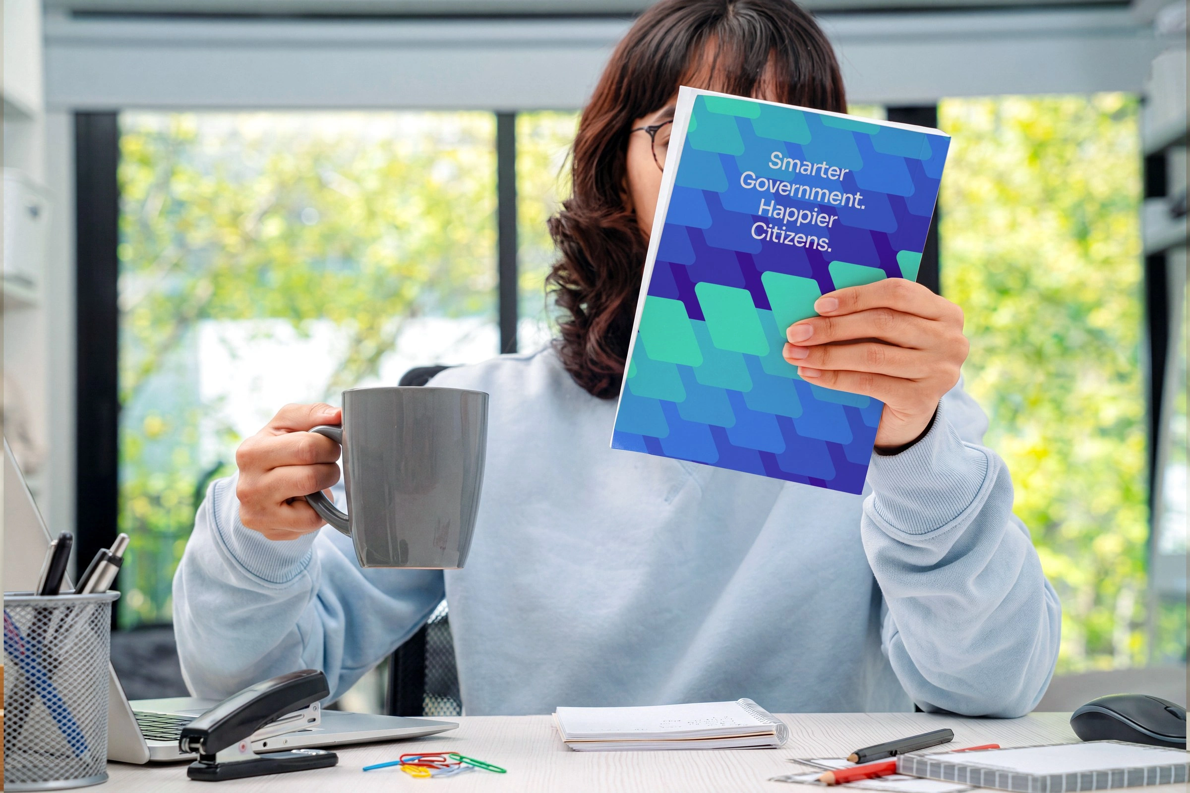 The leave-behind booklet — “Smarter Government. Happier Citizens.”