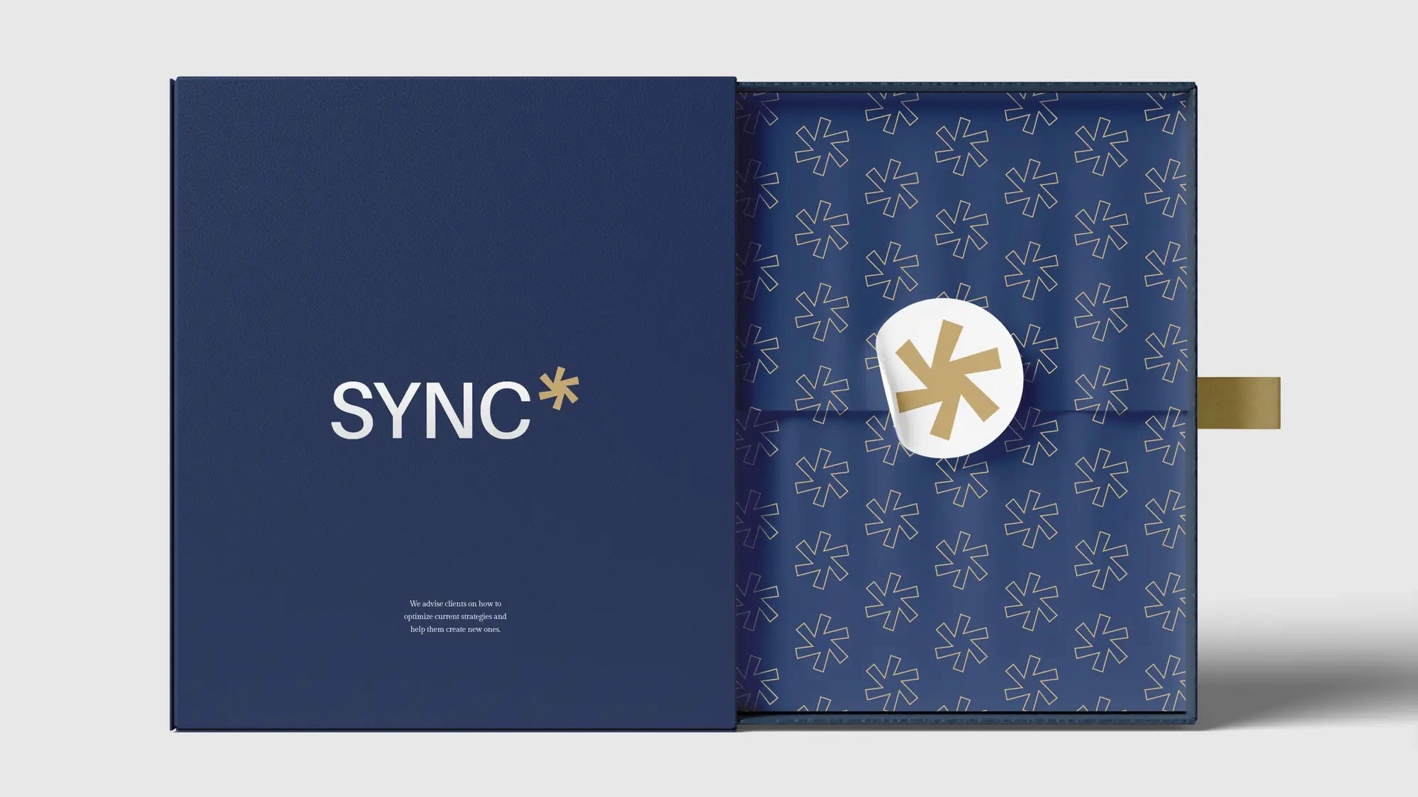 A premium presentation kit — asterisk pattern lining, gold seal, navy throughout